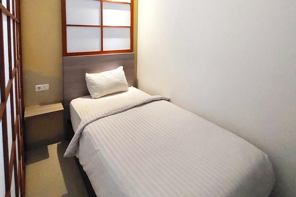 Twospaces Living At Maximus Inn Palembang Exterior photo